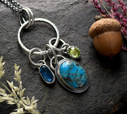 Bright Blue Turquoise Charm Necklace with Teal Kyanite & Peridot | Sterling Silver Charm Necklace featuring Gorgeous Kingman Turquoise